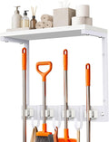 Supforce Small Broom Holder Wall Mount with Shelf, 4 Slots 3 Hooks | White, 2-In-1 Wall Mount Stores Brooms/Mops, Cleaning Supplies With 4 Grippers/3 Hooks And A Sturdy Wooden Top Shelf